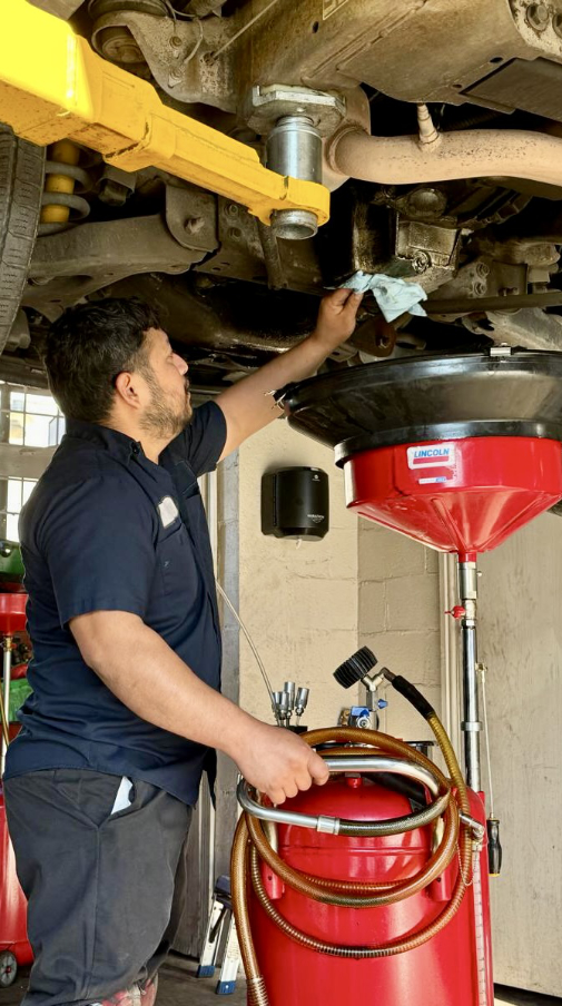 technician working under car